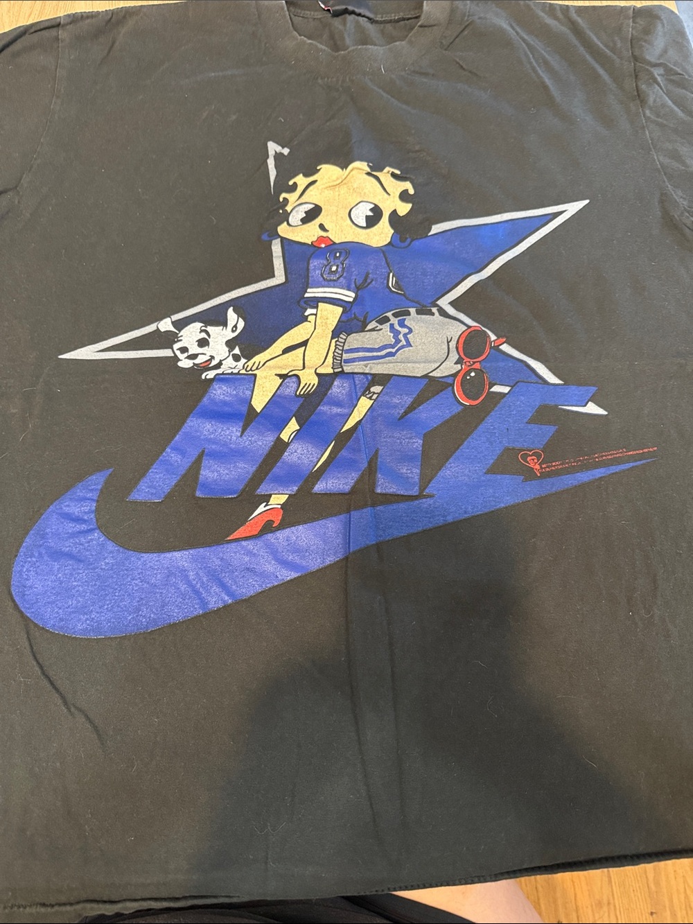 Nike Black Short-Sleeve Tee with Blue Logo and Yellow Character